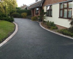 Expertly installed Tarmac driveways by Stone Mark Contractors. Professionally crafted Tarmac driveway by Stone Mark Contractors in Devon, combining smooth finish with long-lasting durability.