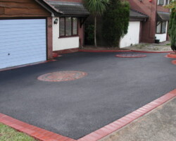 Expert Tarmac driveway solutions by Stone Mark Contractors in Devon. Smooth, high-quality Tarmac driveway installed by Stone Mark Contractors in Devon for residential and commercial properties.